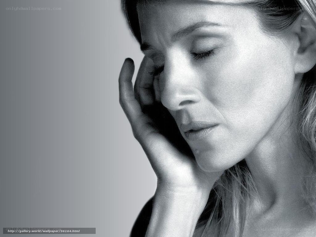 woman with hand on face