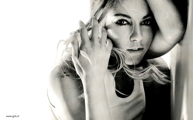 woman with hand on face