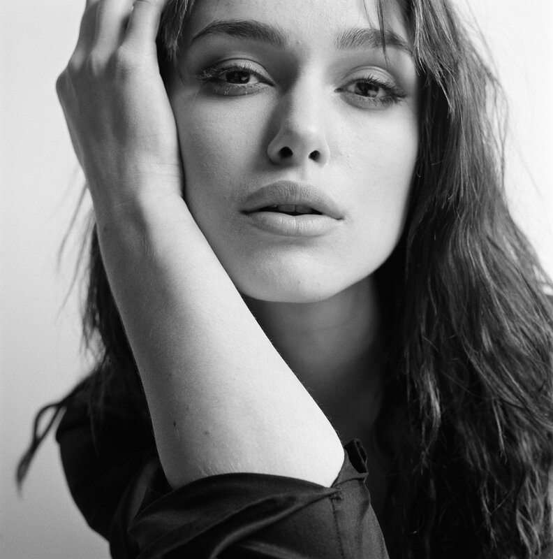 woman with hand on face