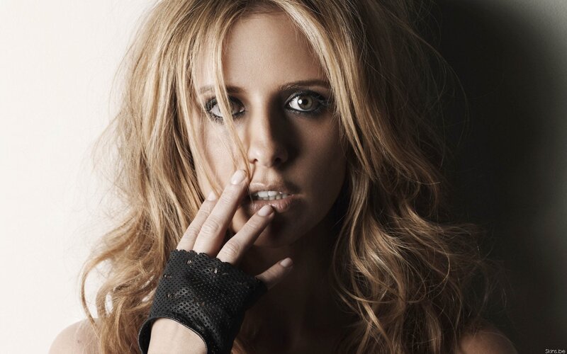 woman with hand on face