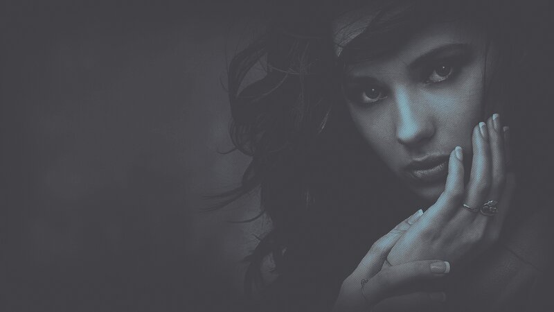 woman with hand on face