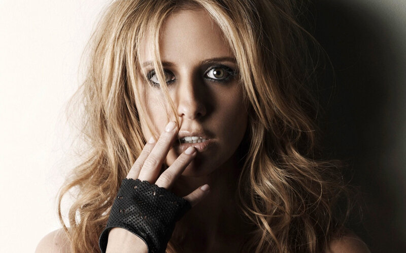 woman with hand on face
