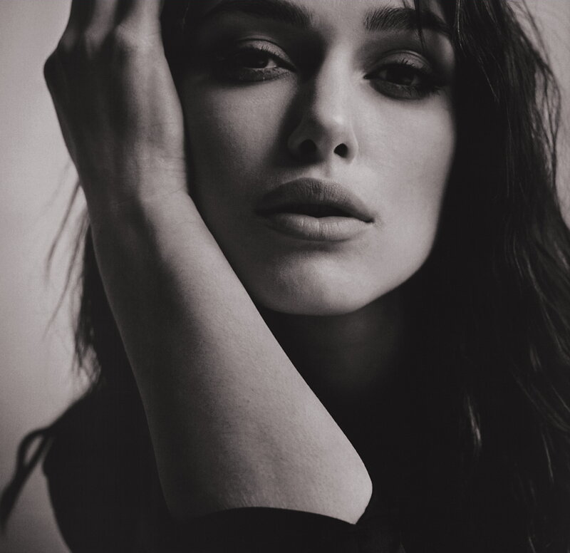 woman with hand on face
