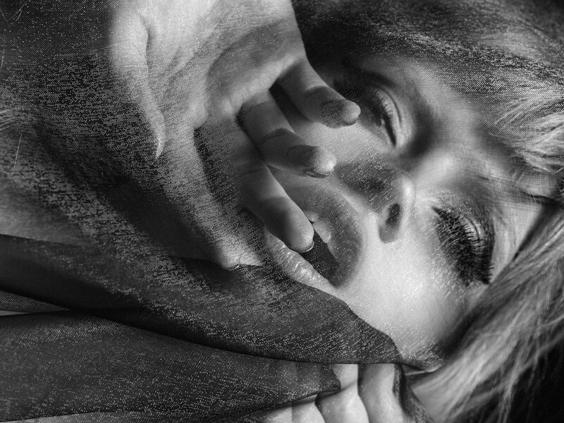 Woman with Hand on Face — Black, Dramatic, Photograph, Fabric
