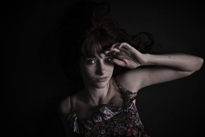 woman with hand on forehead