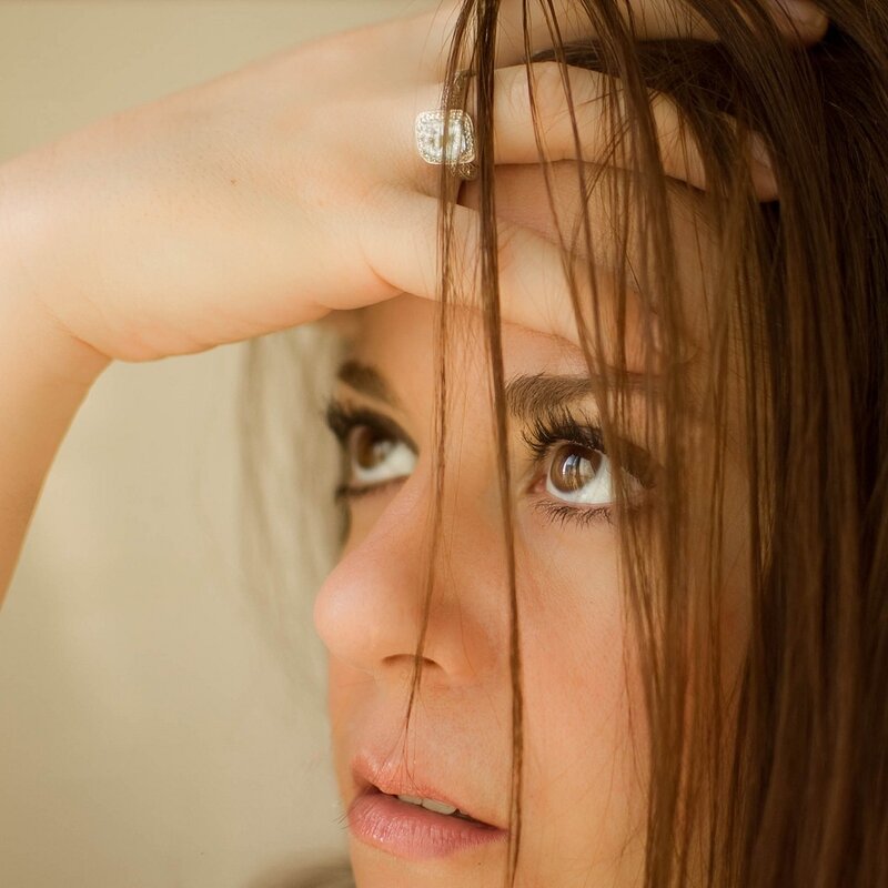 woman with hand on forehead