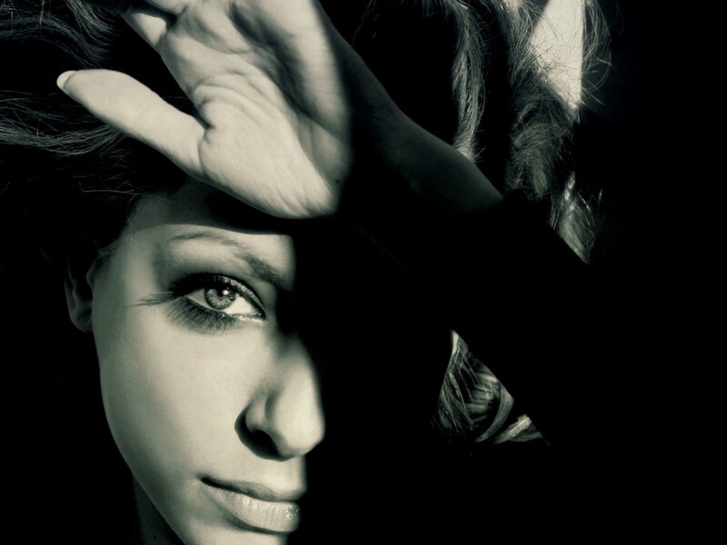 Woman with Hand on Forehead — Black, Dramatic