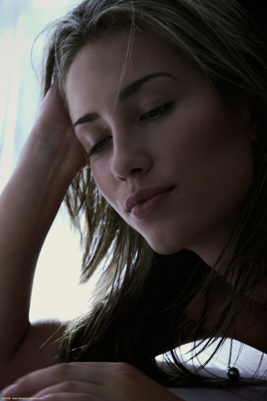 woman with hand on head