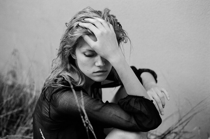 Woman with Hand on Head — Black, Somber