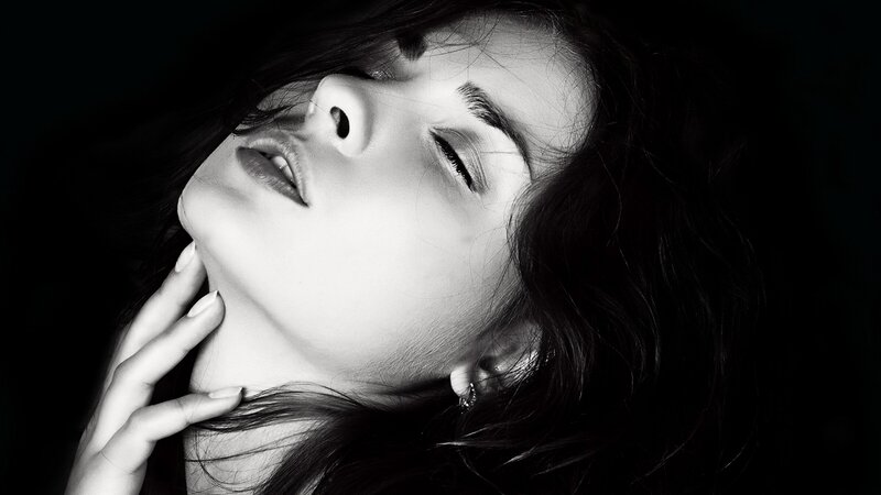 Woman with Hand on Neck — Black