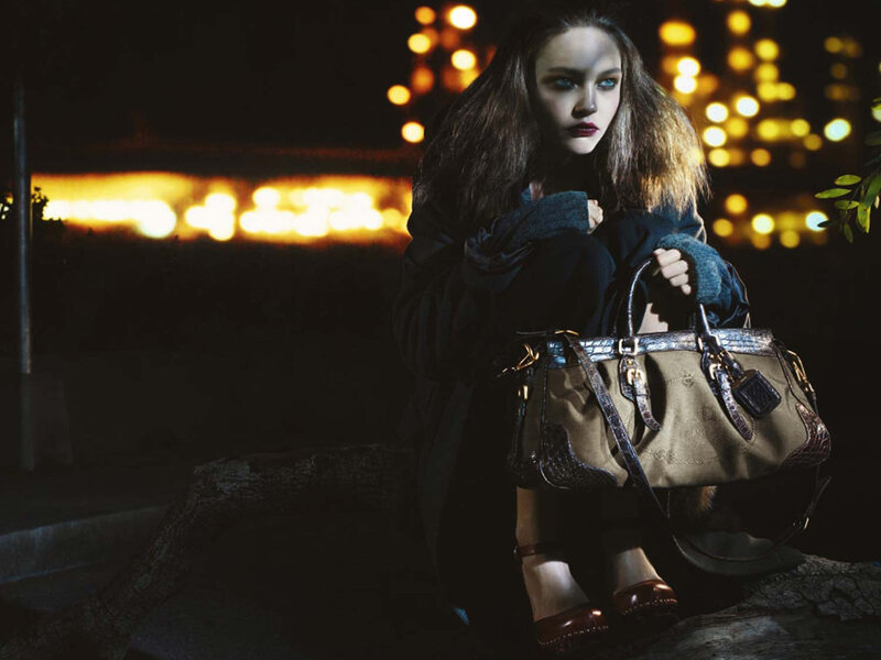 woman with handbag at night