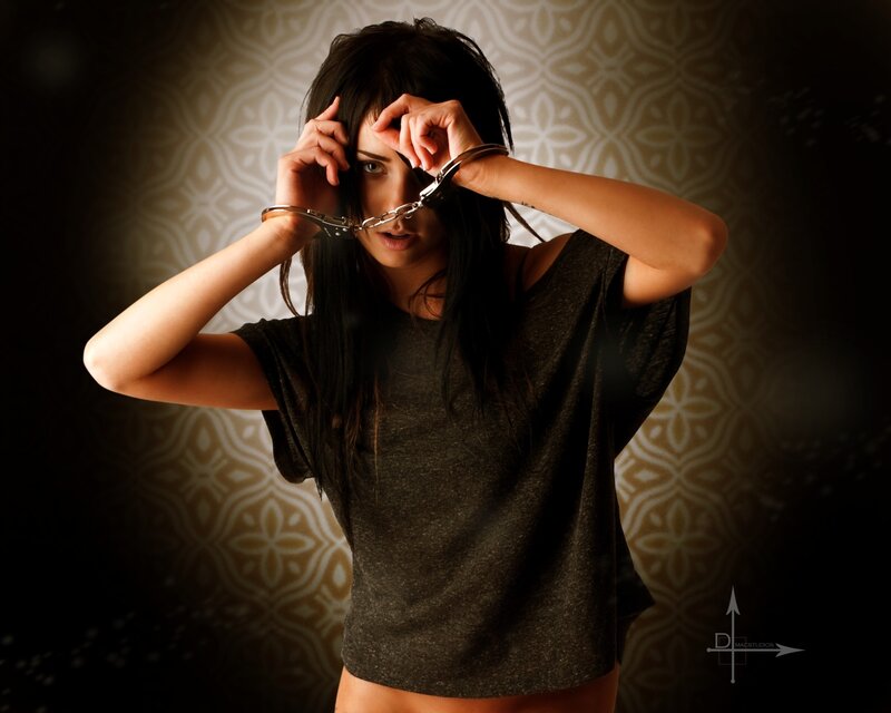 woman with handcuffs in studio