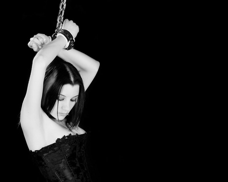 woman with hands bound above head