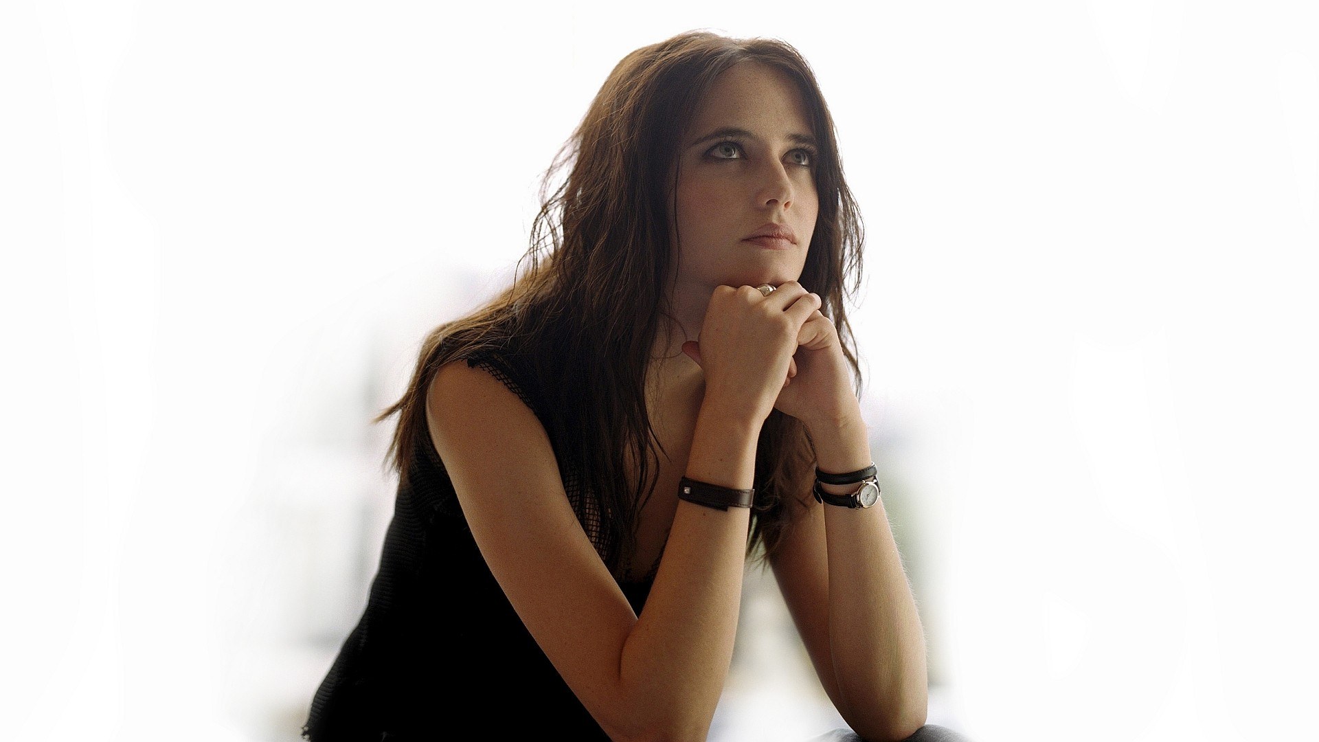 woman with hands clasped