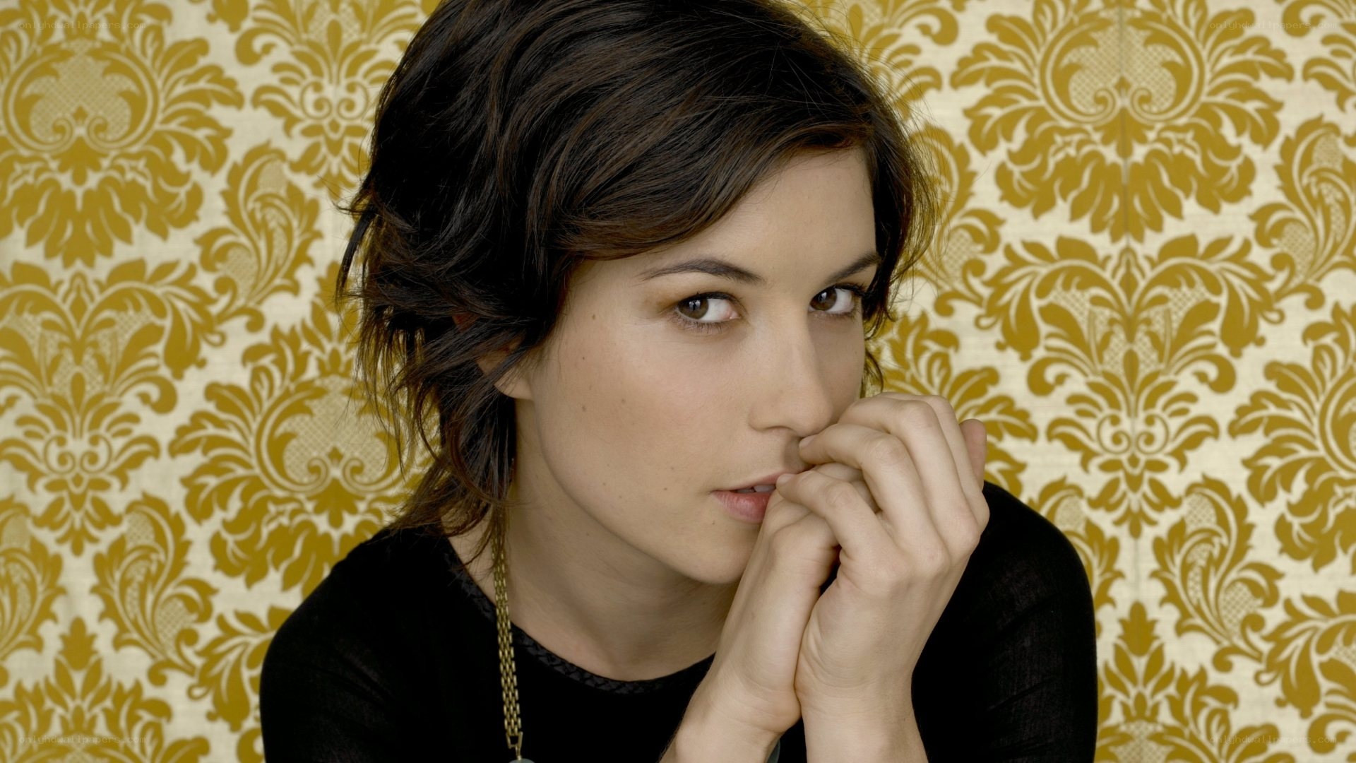 woman with hands clasped