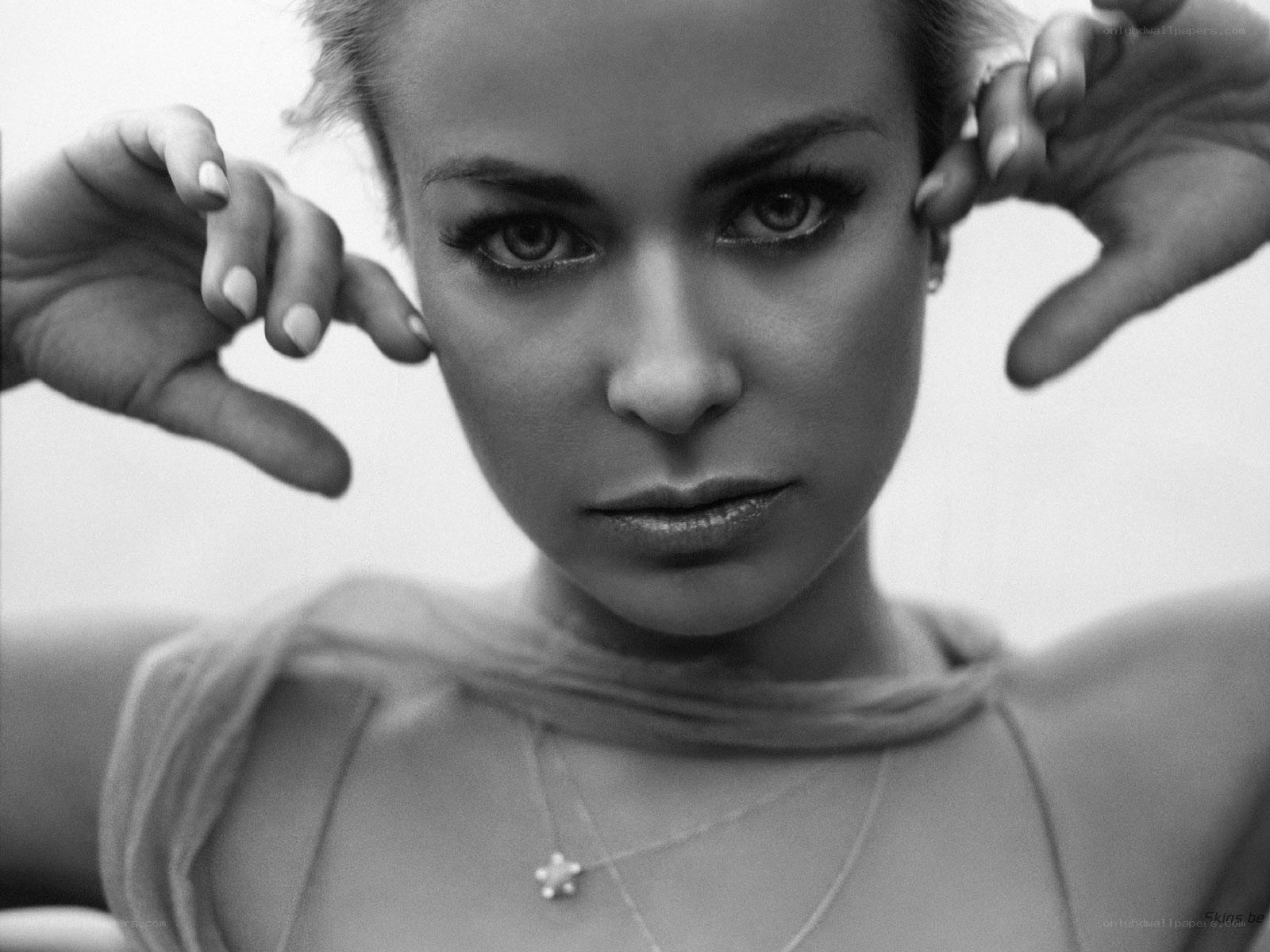 woman with hands framing face