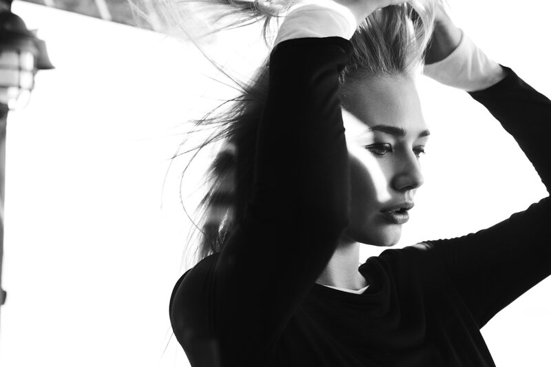 woman with hands in hair