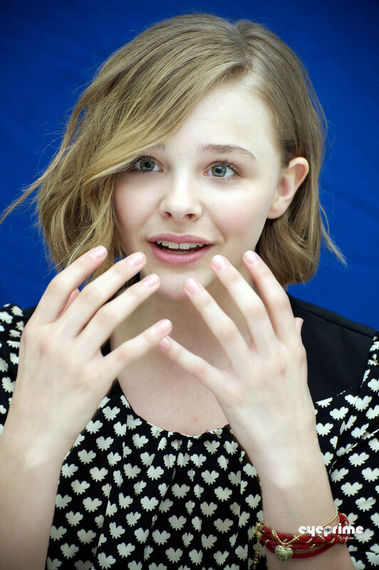 woman with hands near face