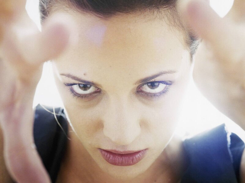 woman with hands near face