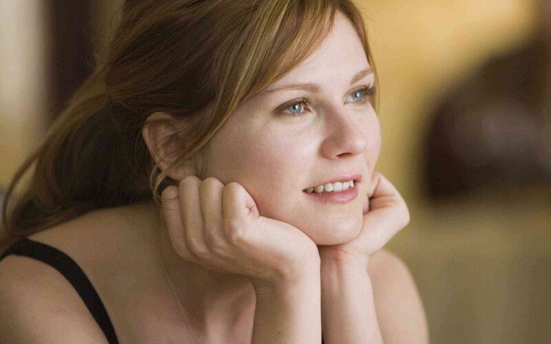 woman with hands on cheeks