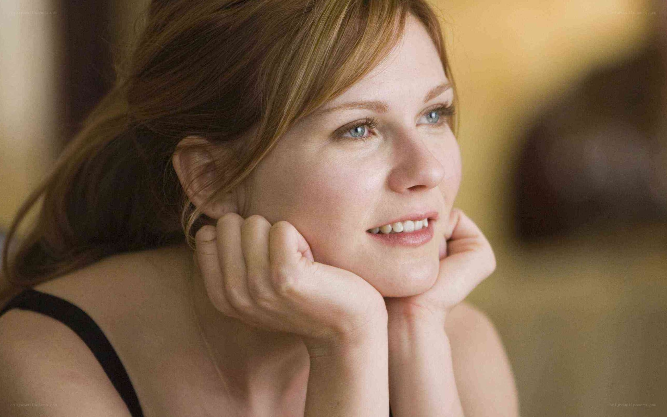 woman with hands on cheeks