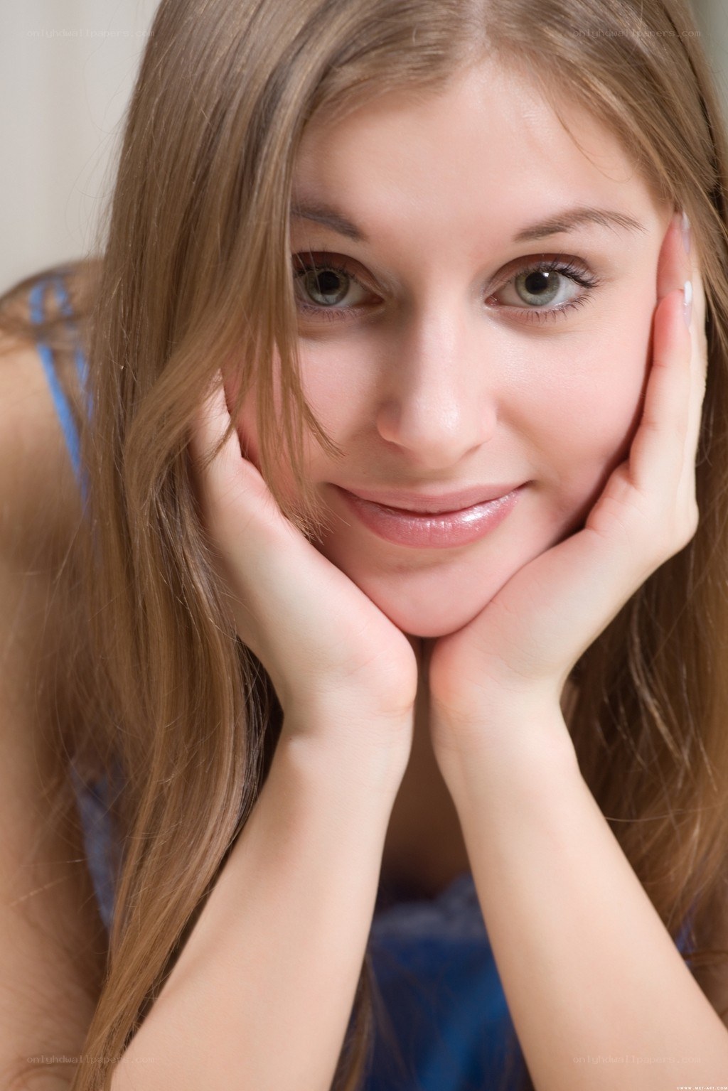 woman with hands on cheeks