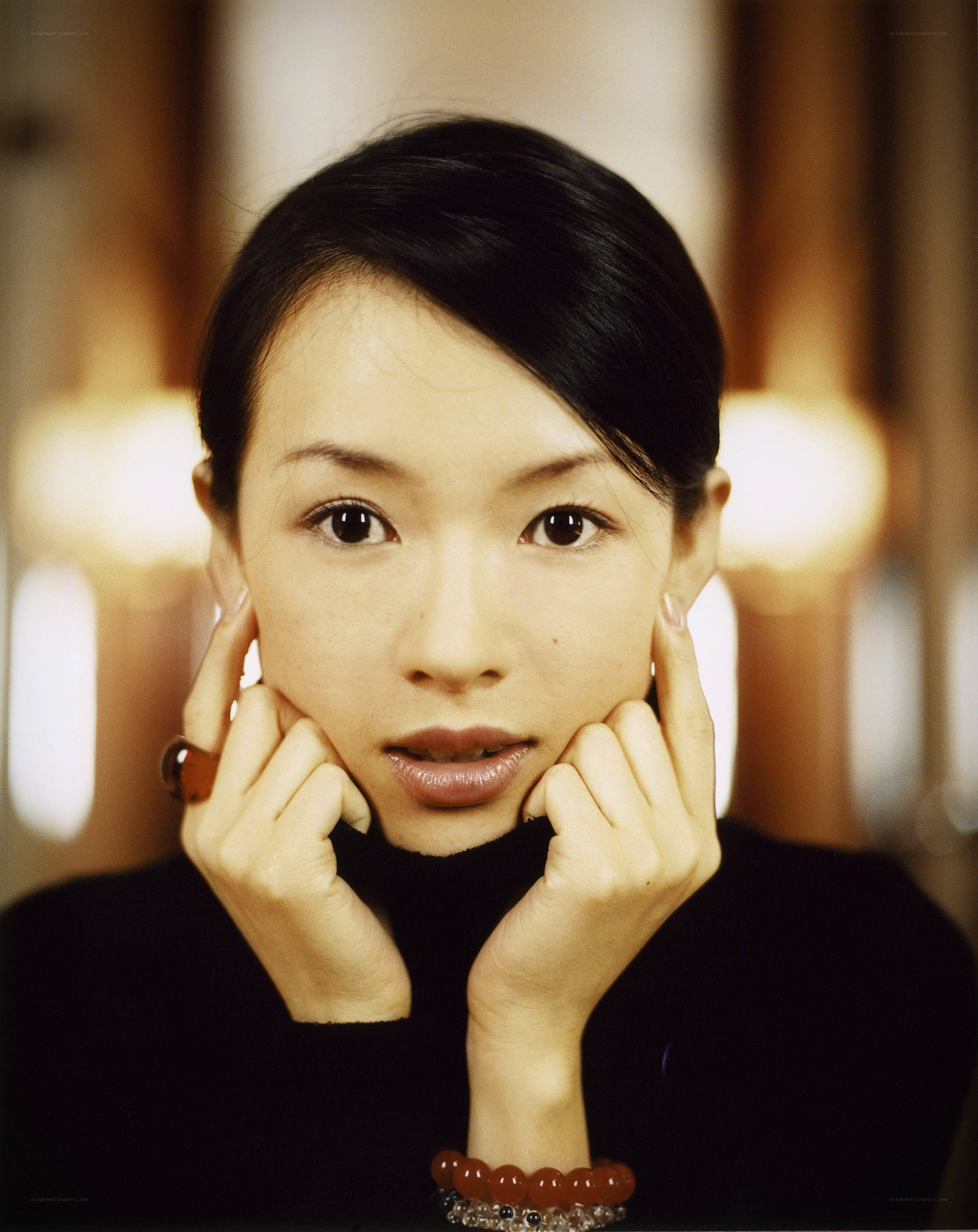 woman with hands on cheeks