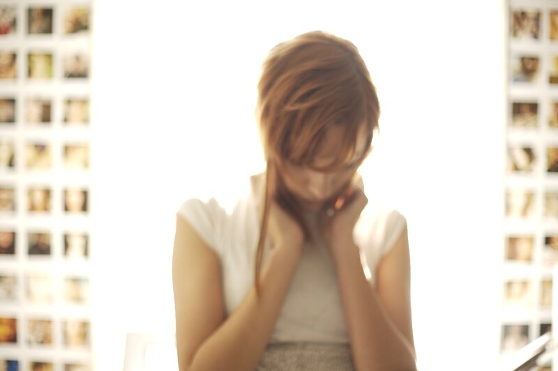 woman with hands on face