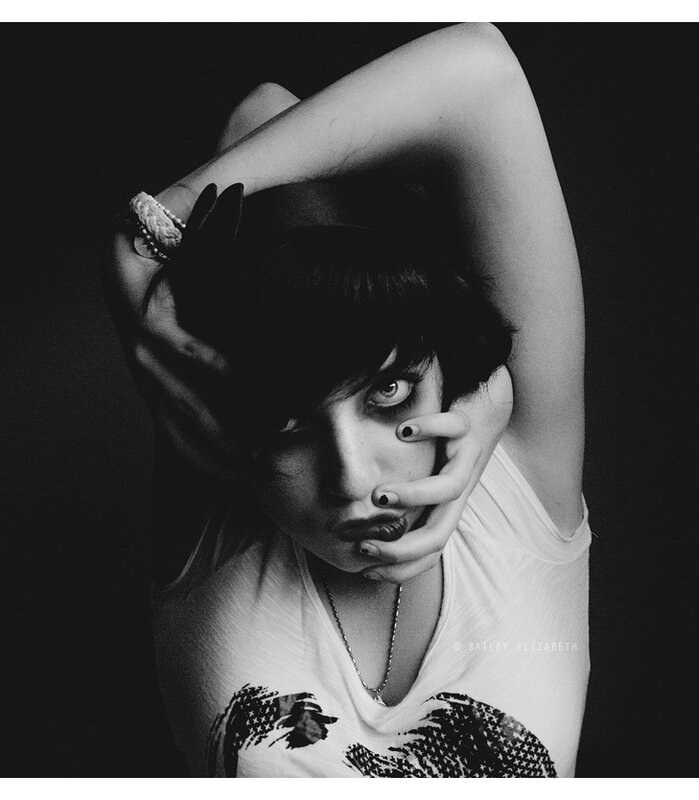 woman with hands on face