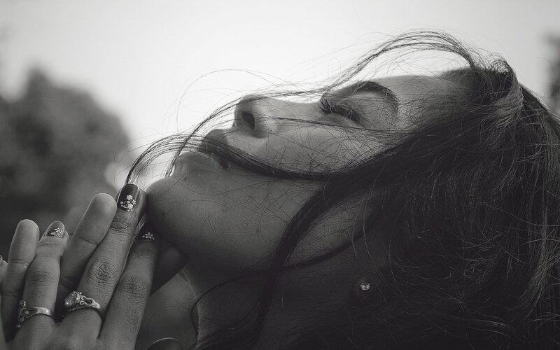 woman with hands on face