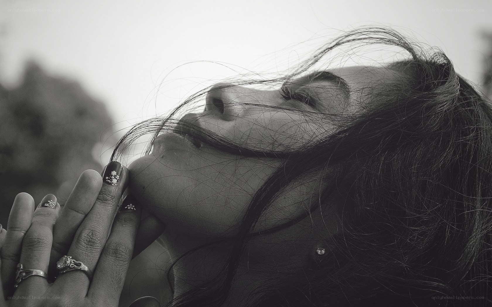 woman with hands on face