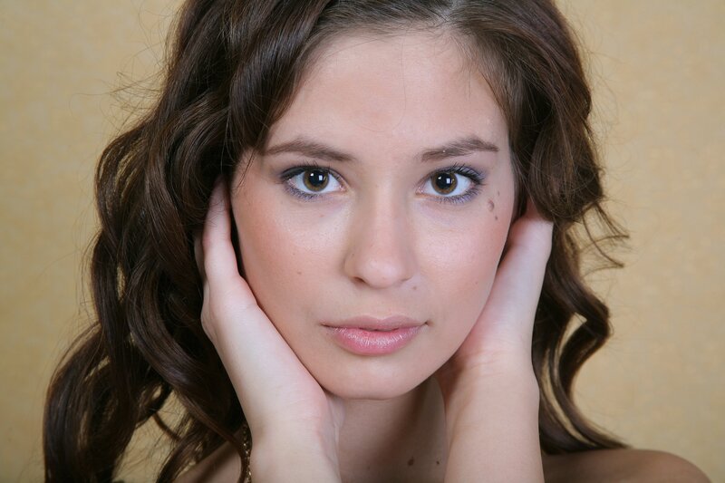 woman with hands on face