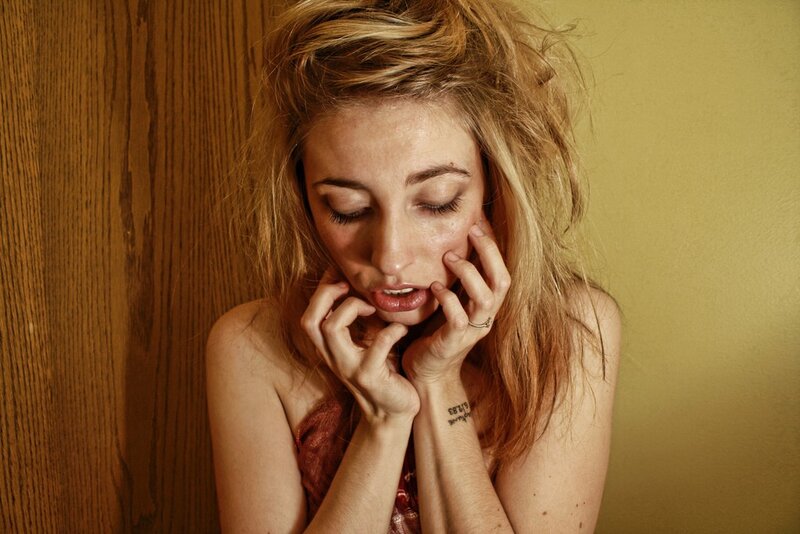 woman with hands on face