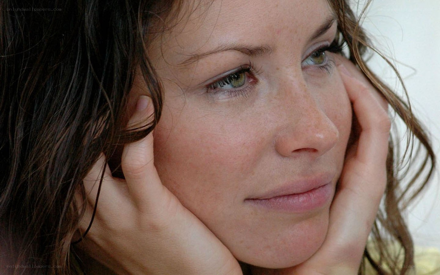 woman with hands on face