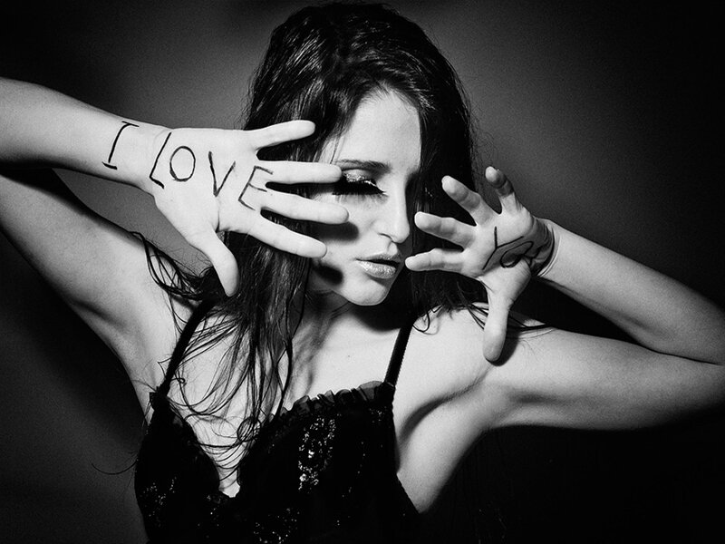 Woman with Hands on Face — Black, Dramatic, Photograph, Text