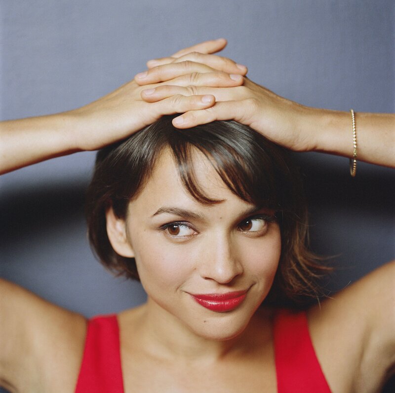 woman with hands on head
