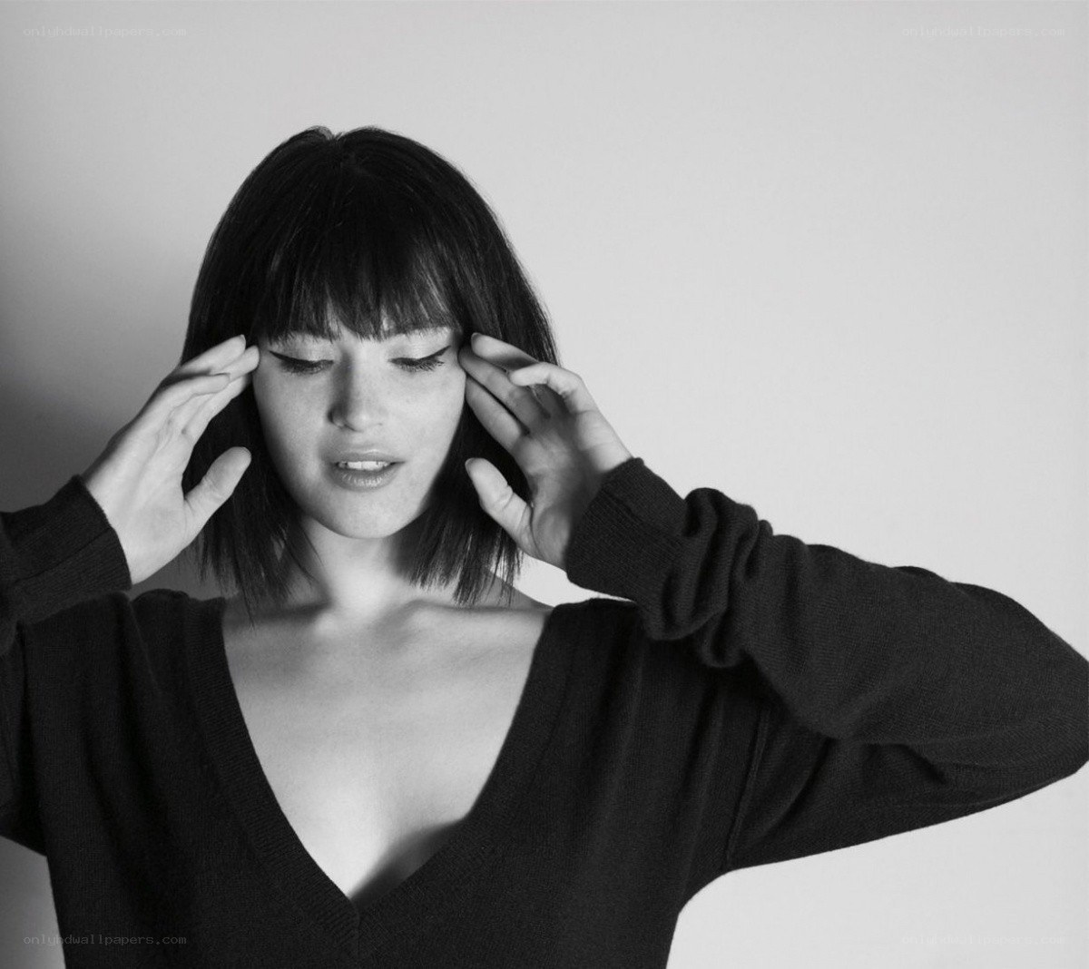 woman with hands on head
