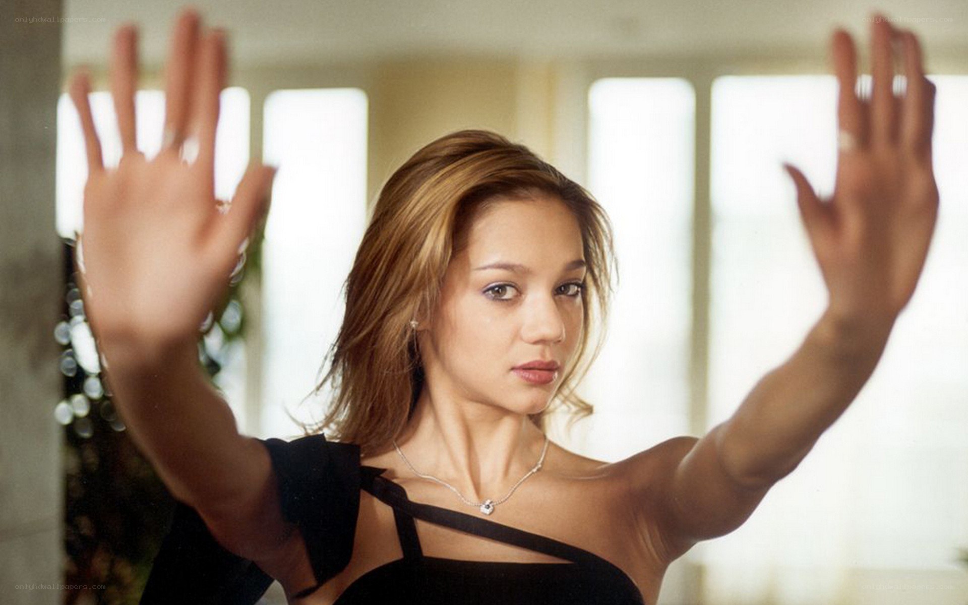 woman with hands raised