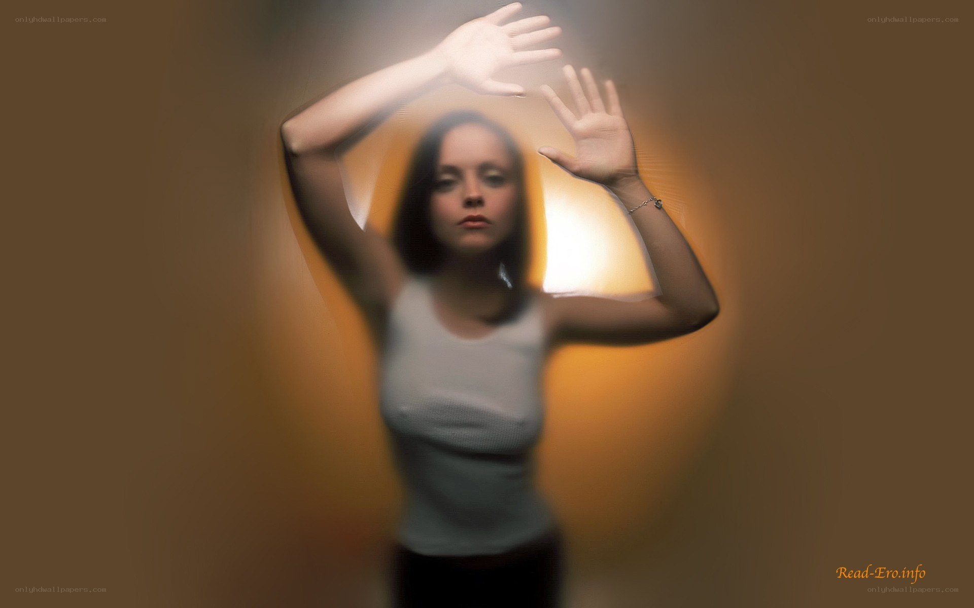 woman with hands raised