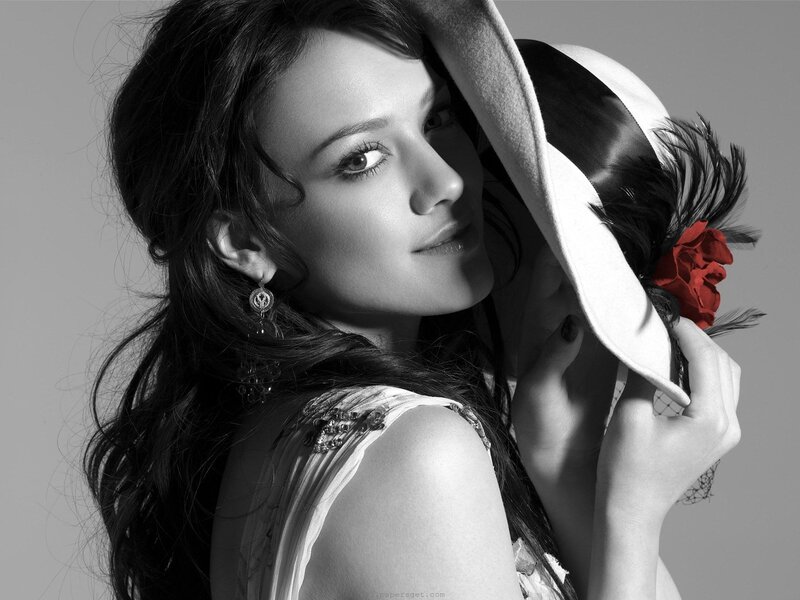 woman with hat and red flower