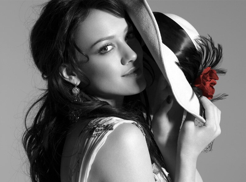 woman with hat and red flower