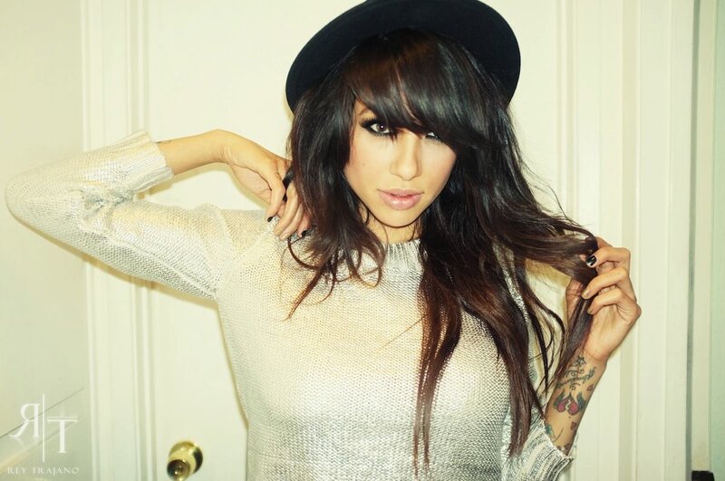 woman with hat and tattoos