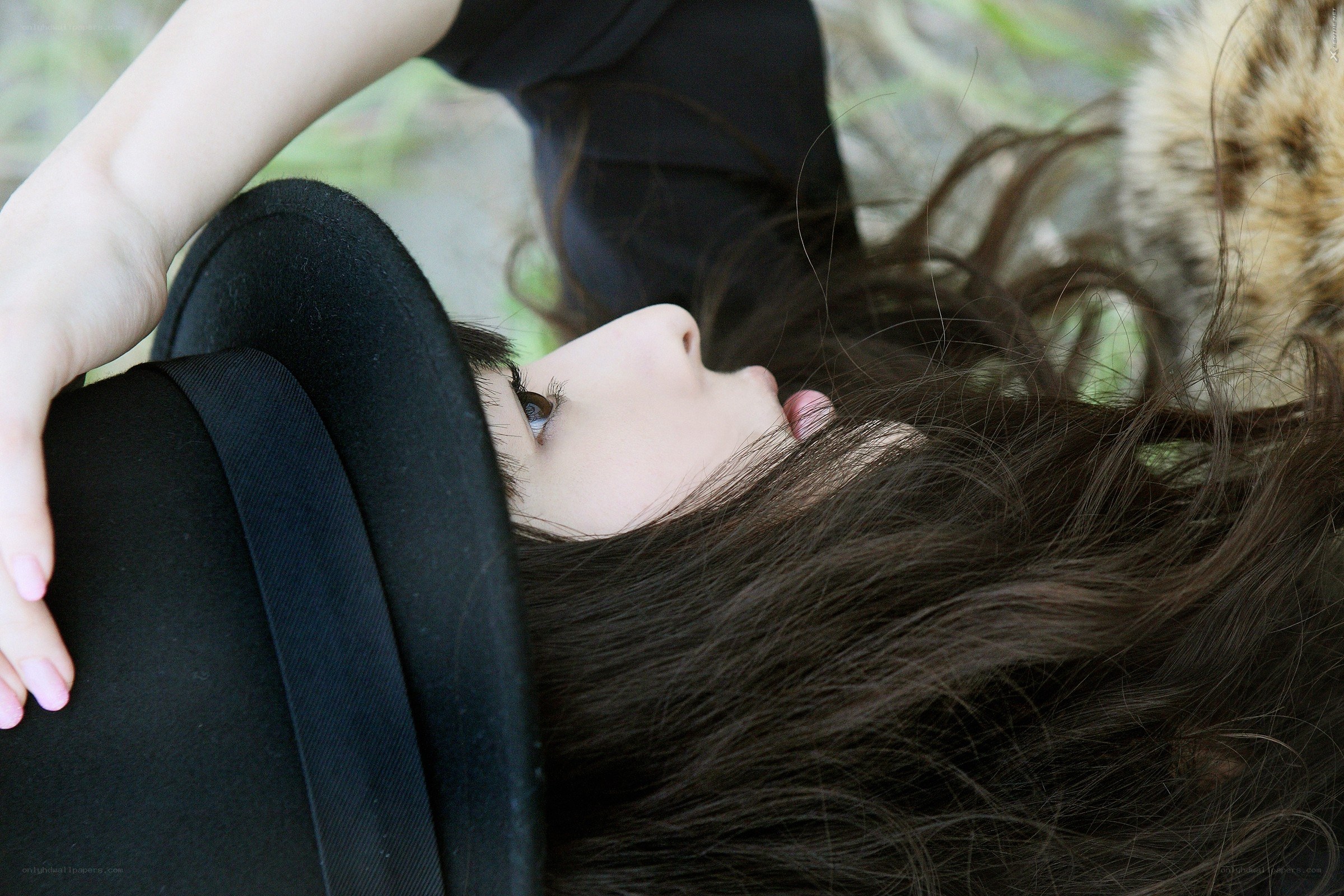 woman with hat lying down
