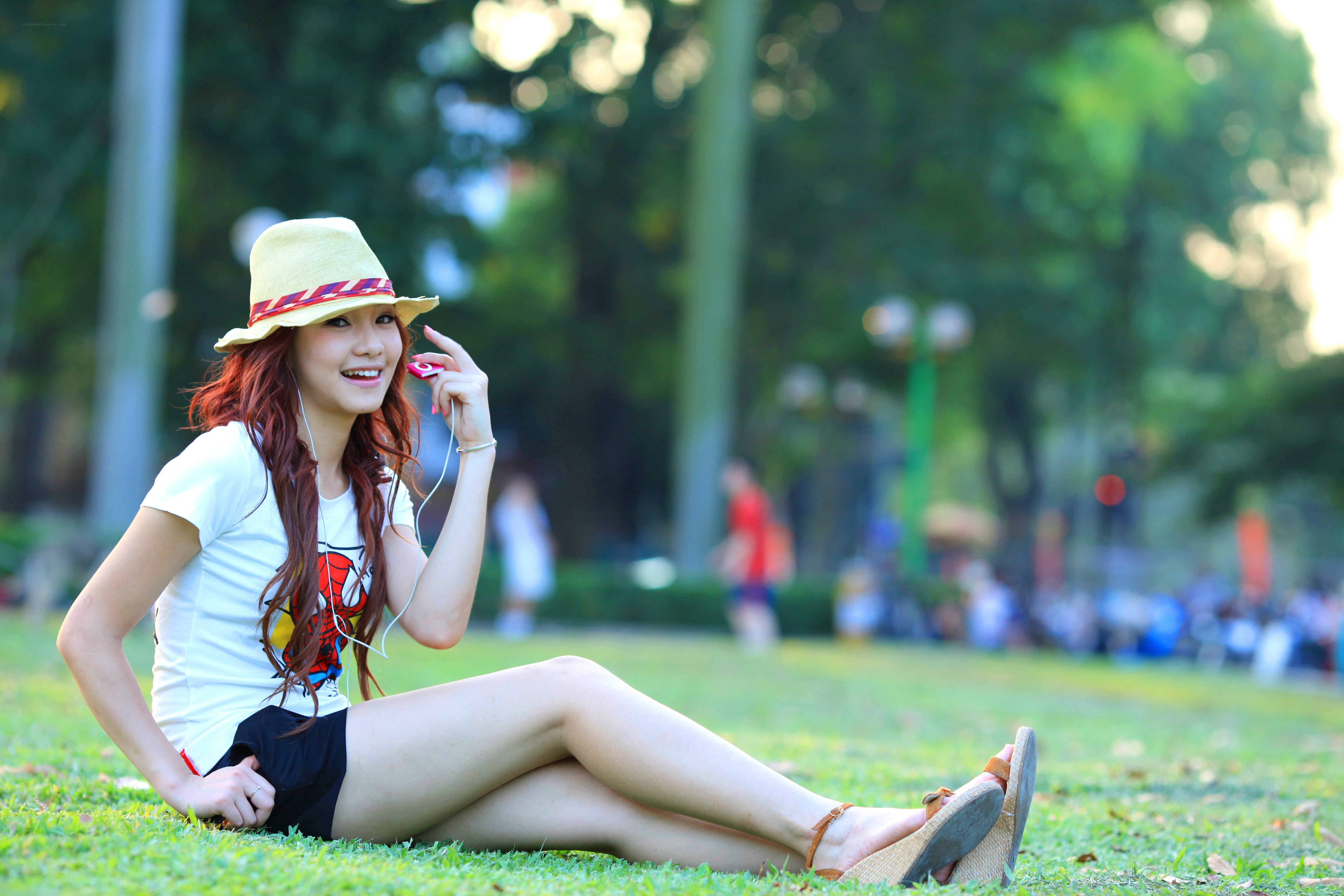 Woman with hat on grass