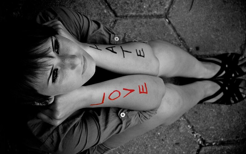 woman with hate and love on arms