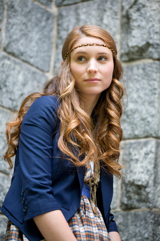 woman with headband and blazer