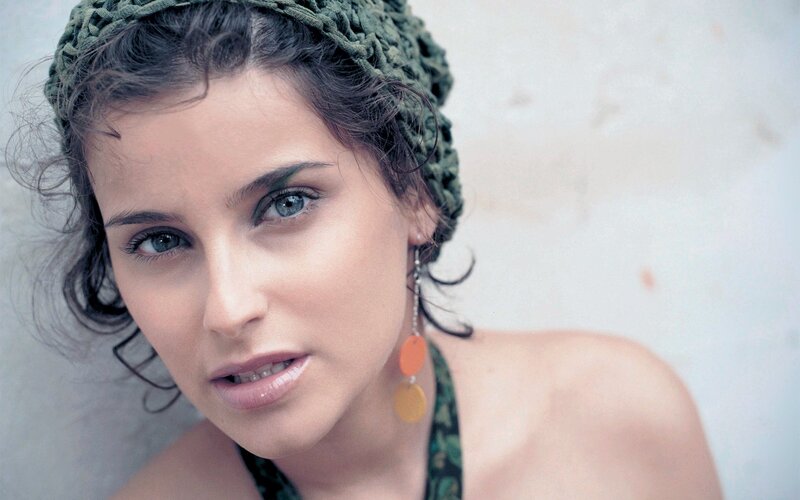 woman with headband and earrings
