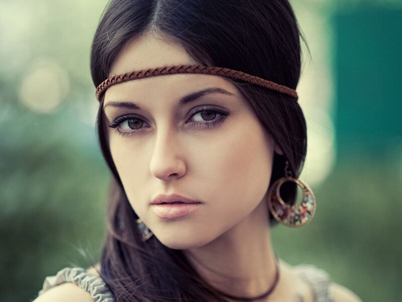 woman with headband and earrings