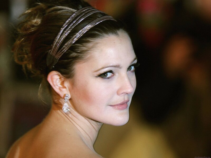 woman with headband and earrings