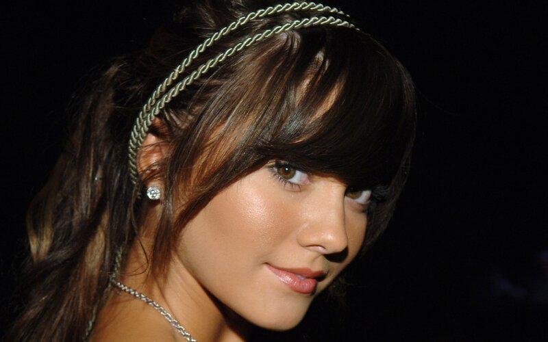 woman with headband and earrings